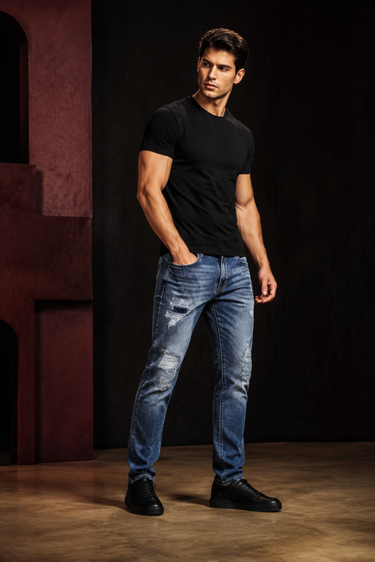 Men’s distressed patch slim jeans styled in Tanzy streetwear editorial