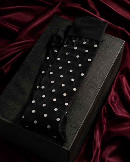 Black polka-dot fashion socks in a Tanzy editorial